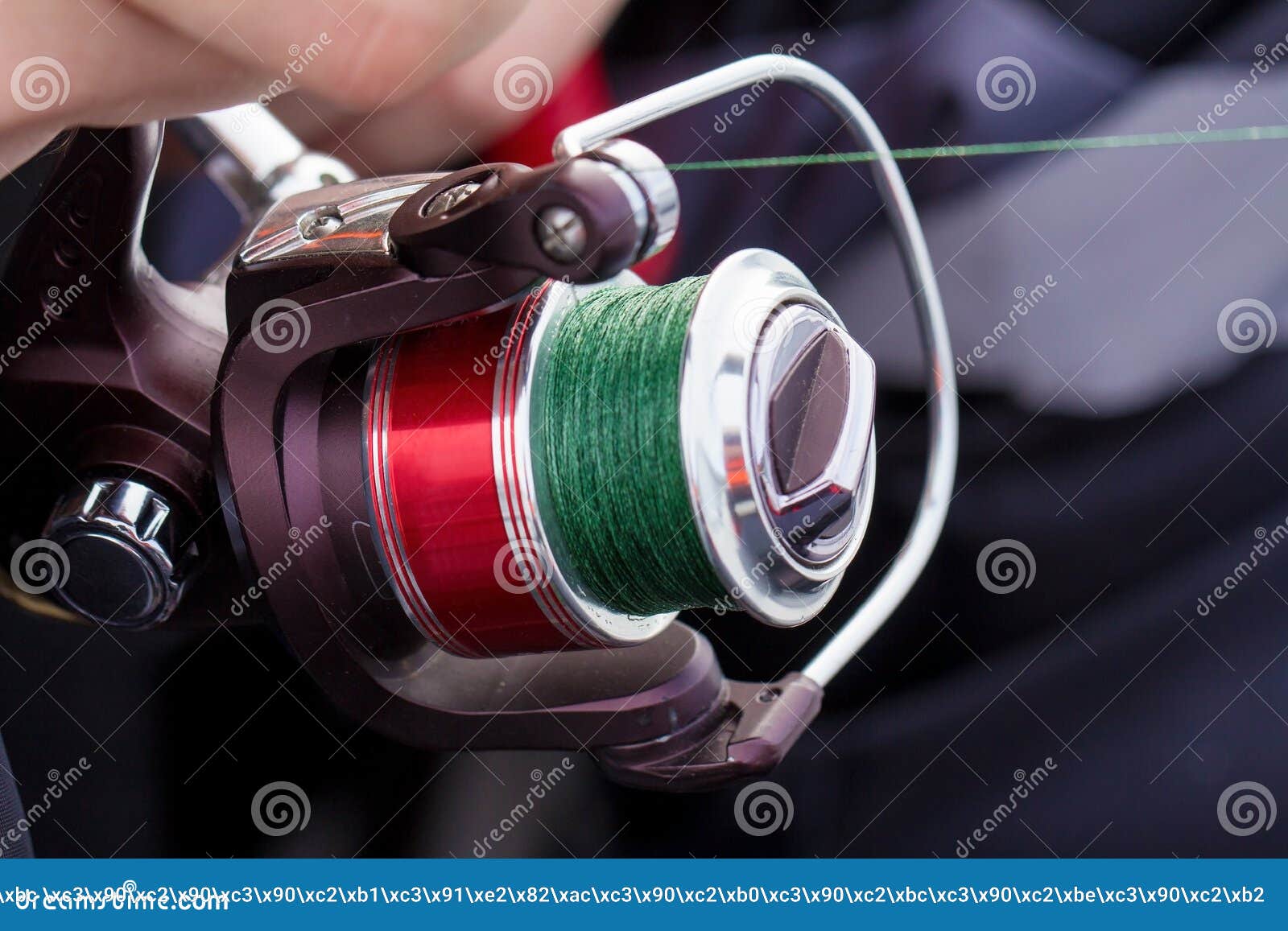 To Prepare A Rod For Fishing The Man Catches Fish On A Spinning Stock